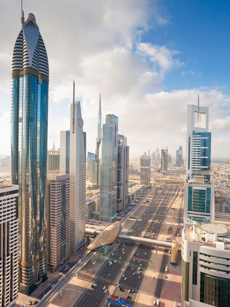 A minimalist and well-lit interior of a high-end designer boutique in Abu Dhabi.