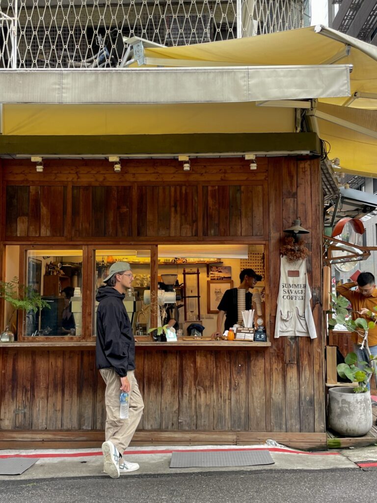 A close-up of steaming Xiao Long Bao dumplings inside a traditional bamboo steamer basket.