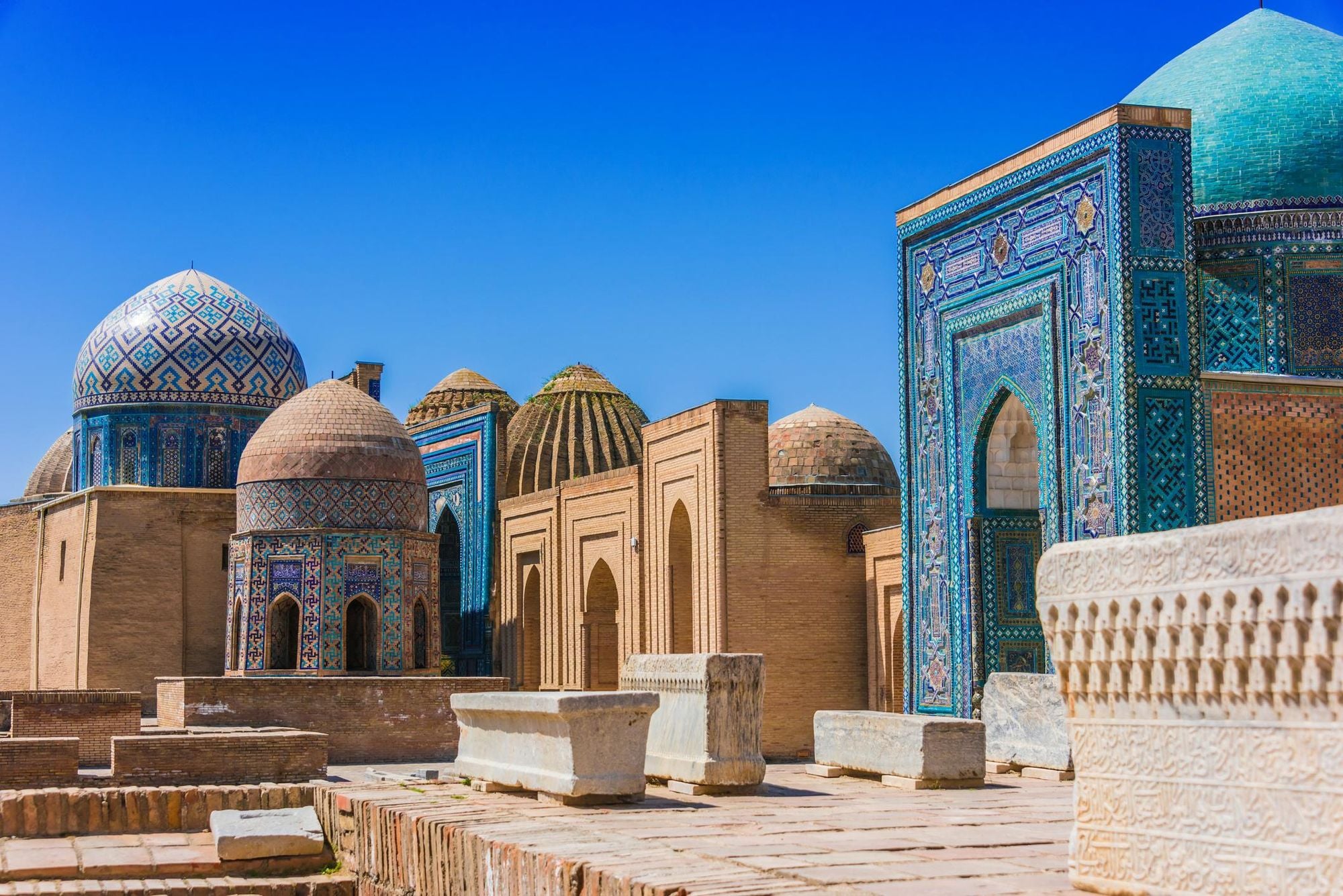 The intricate blue-tiled architecture of the Shah-i-Zinda necropolis in Samarkand.