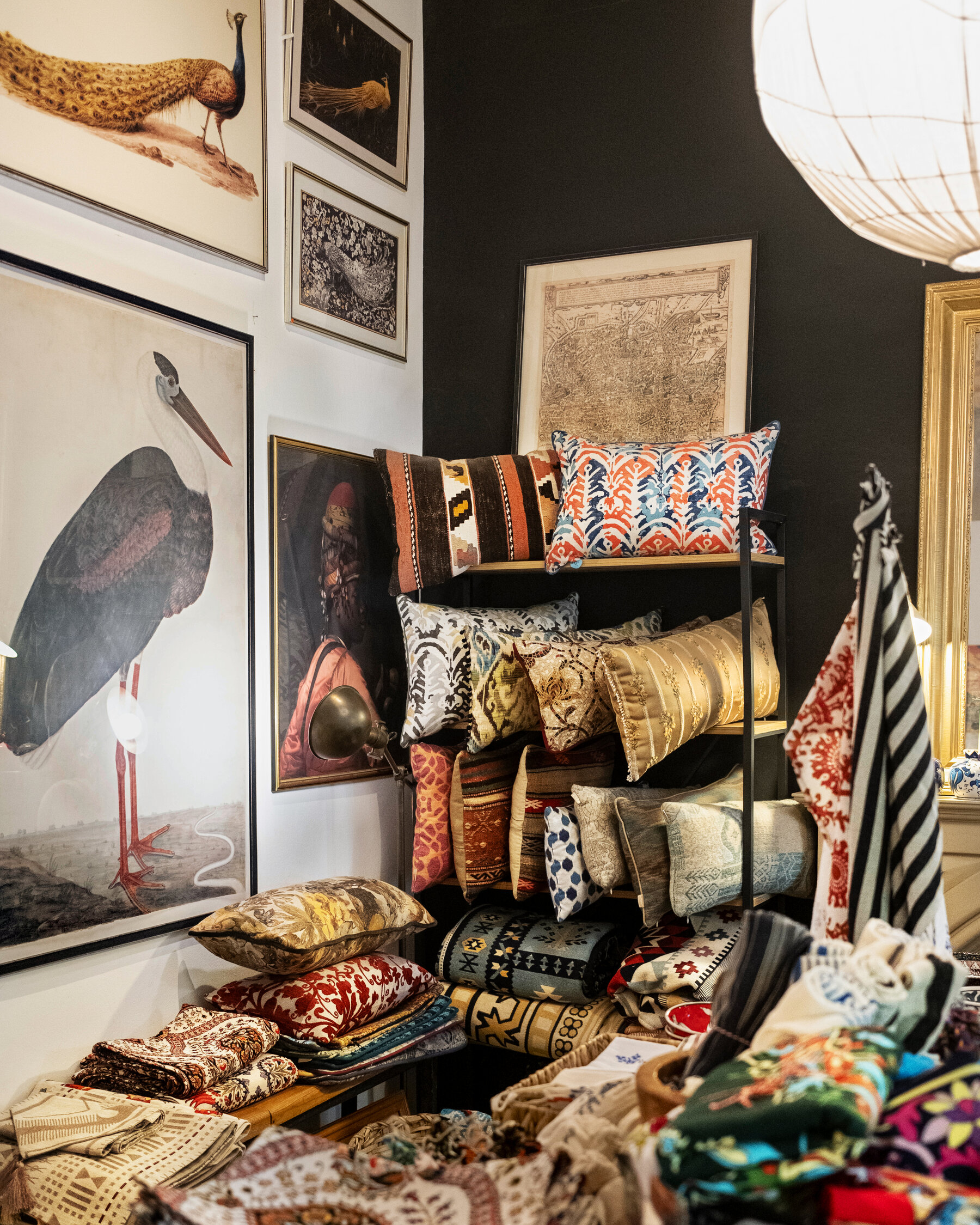 The interior of a contemporary Turkish boutique with modern paintings and designer textiles.