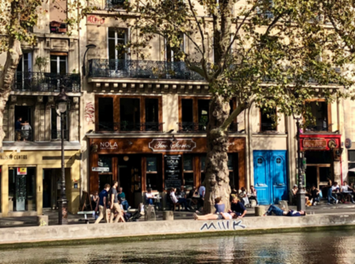 Scenic view of trees and pedestrian walkways along the Canal Saint-Martin.