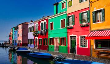 Architectural view of historic Venetian buildings and arches.