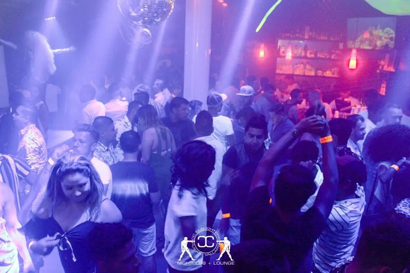 The neon-lit exterior entrance of CC Slaughters nightclub in Puerto Vallarta.