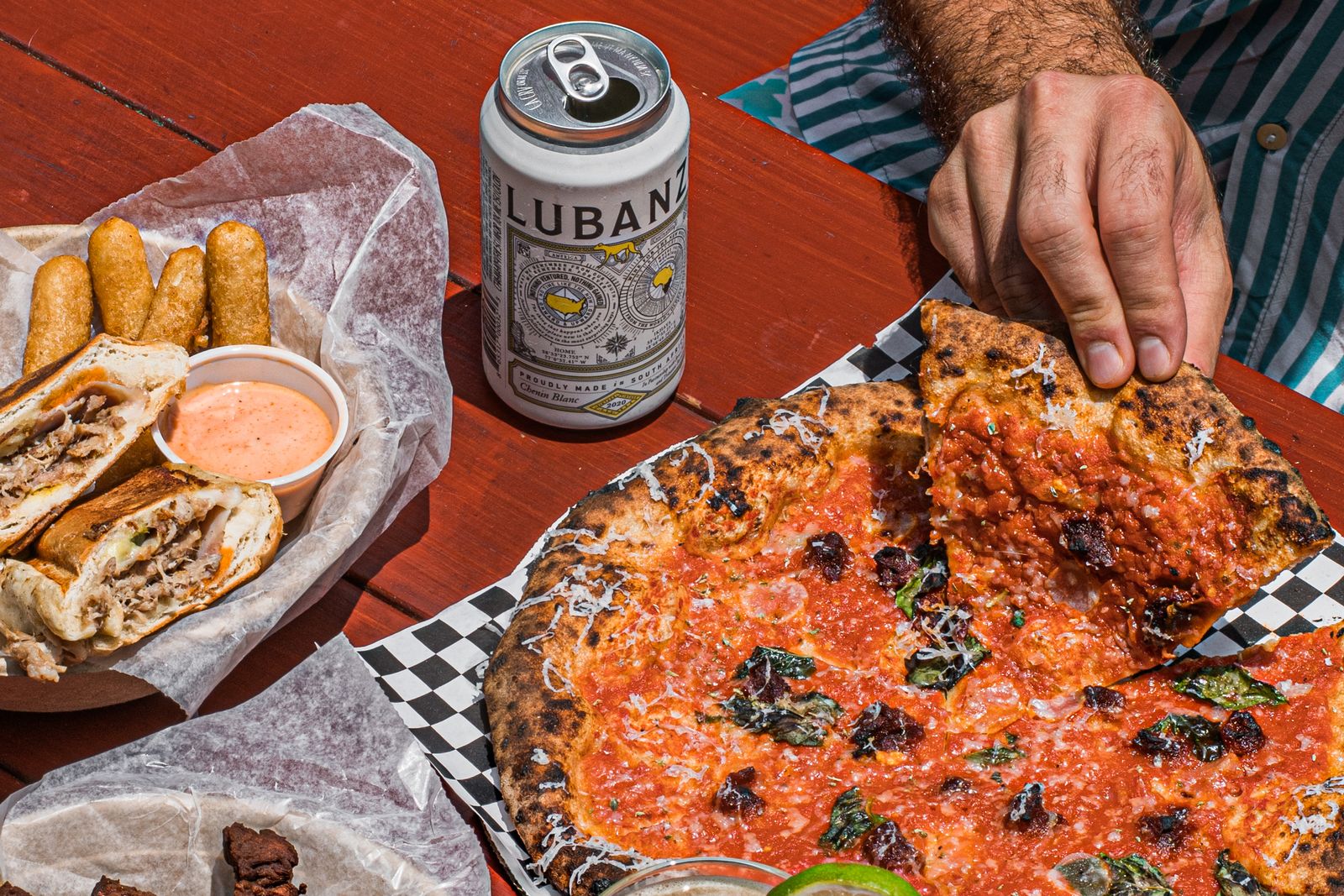 Wide shot of Starland Yard featuring shipping container vendors and outdoor seating.