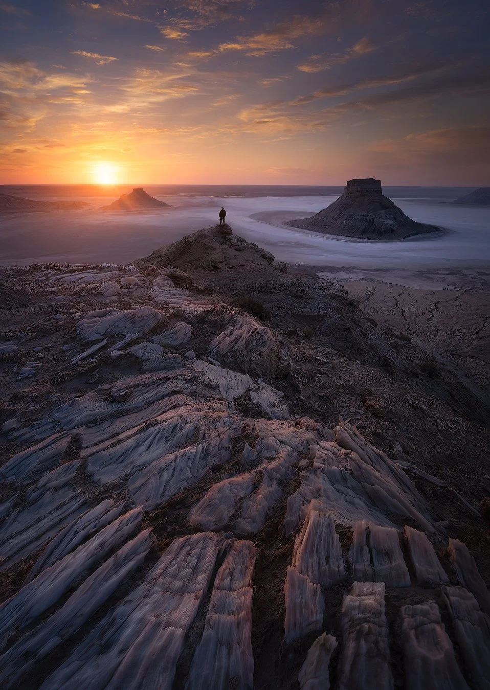 Field of large, naturally formed spherical rocks scattered across a desert landscape.