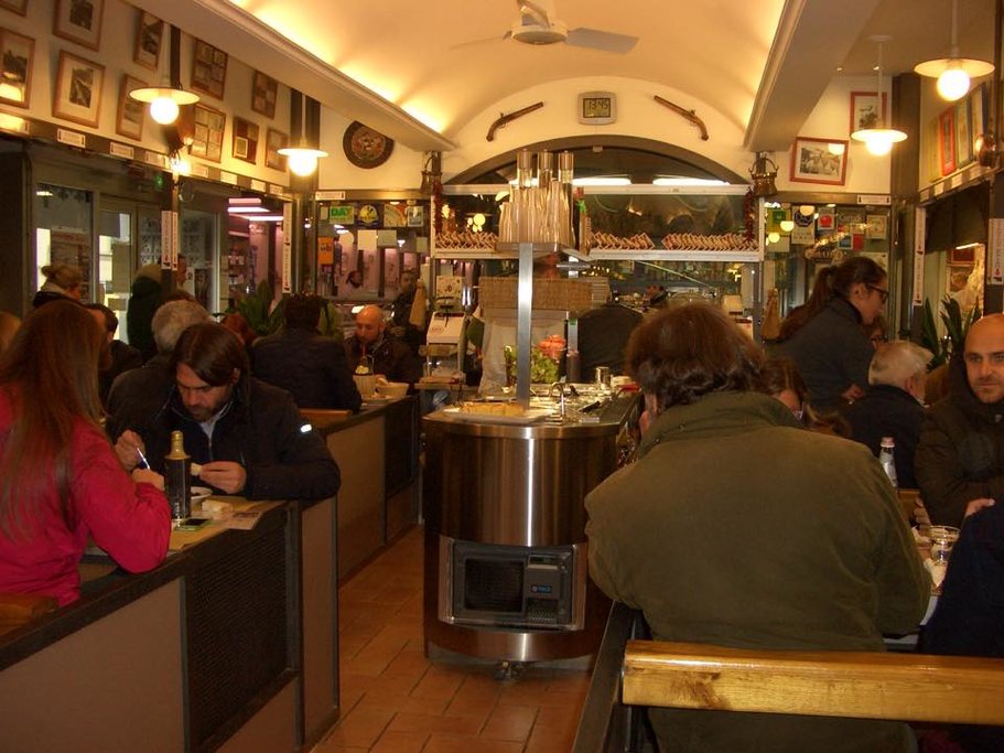 The casual dining area of Trattoria da Rocco inside the Sant’Ambrogio market.