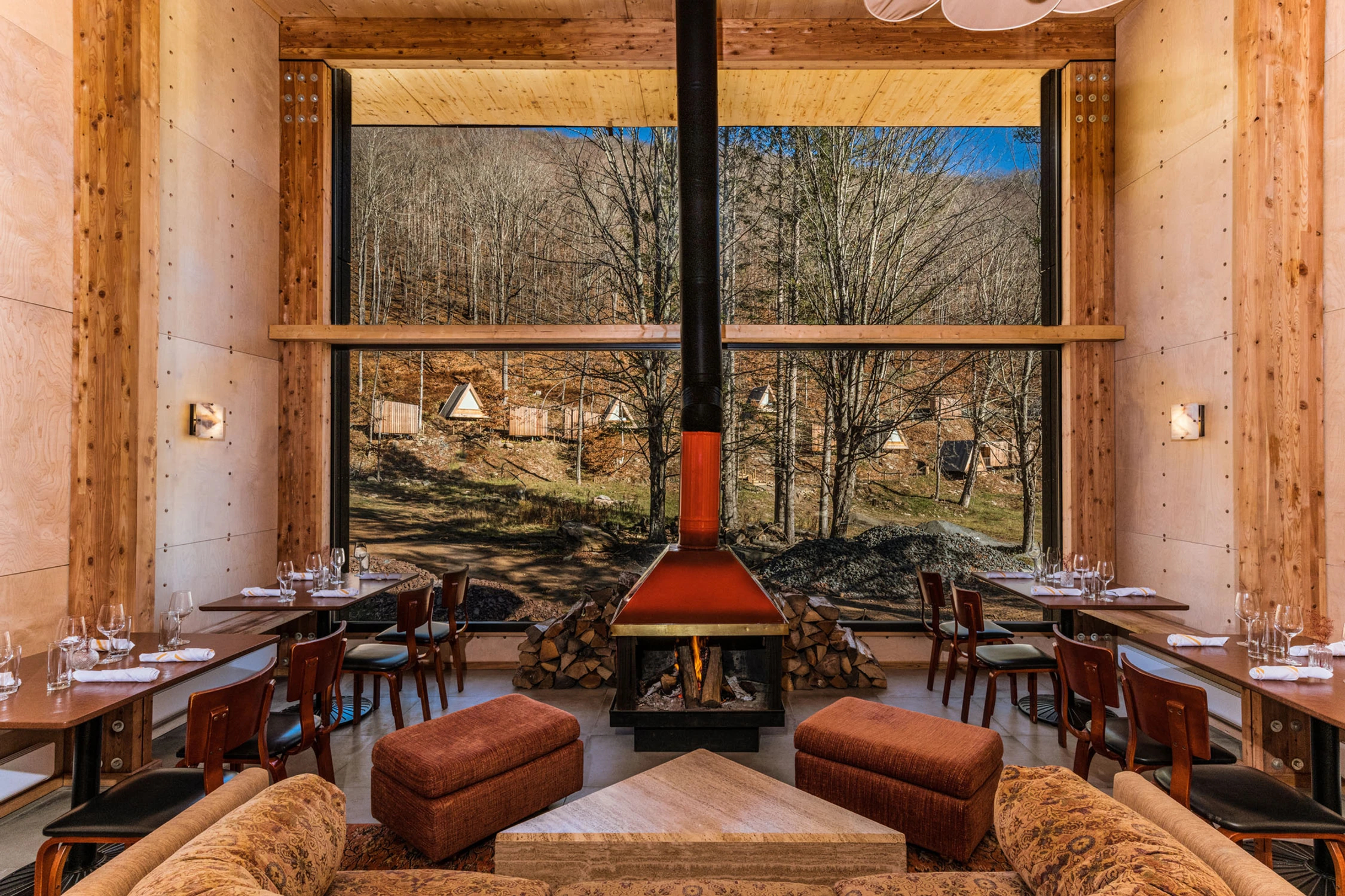 A close-up of a roaring fire in a modern fireplace at the Dandelion bar.