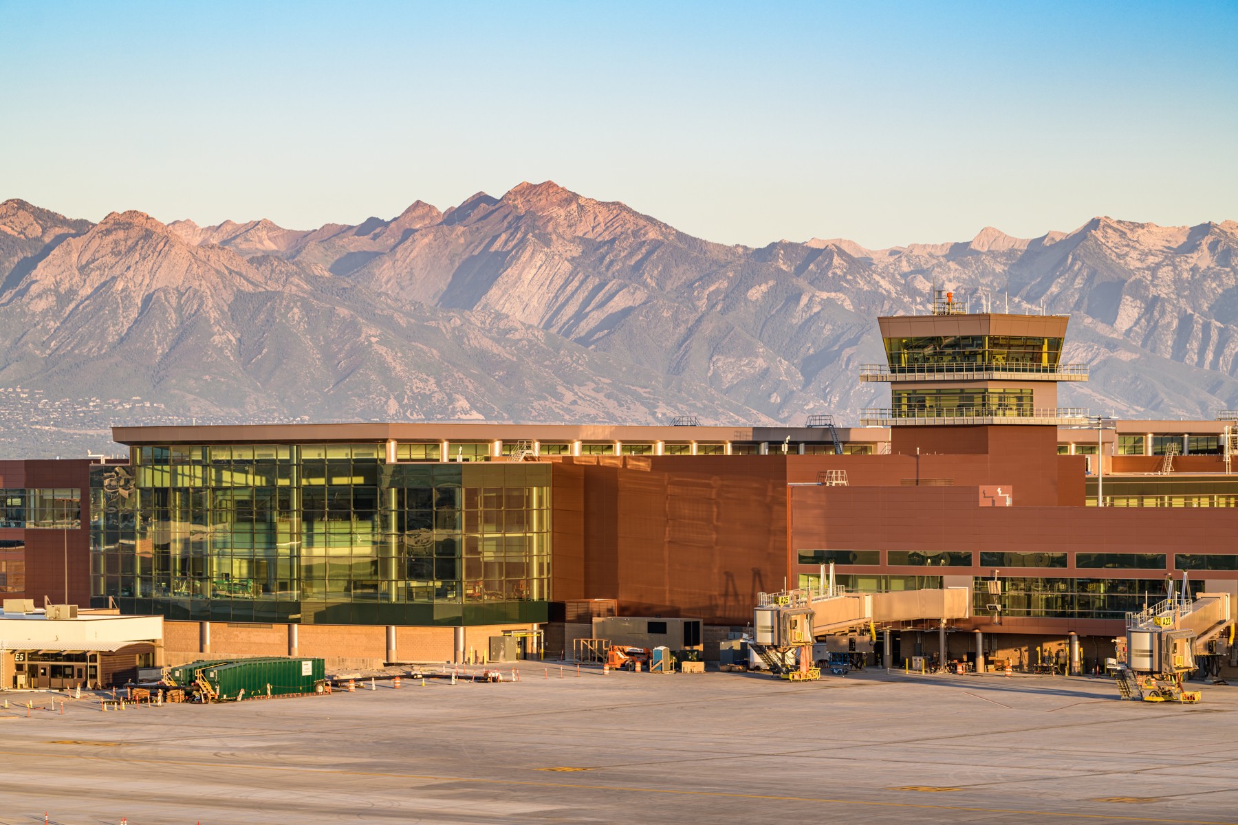 The modern glass and steel exterior of the Salt Lake City International Airport terminal.