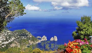 Panoramic coastal view of Pompeii and Sorrento with clear blue waters.