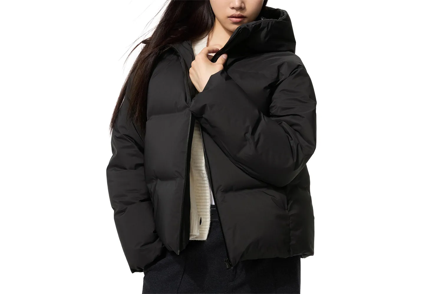 A streamlined, navy blue puffer jacket with a minimalist, non-bulky design.