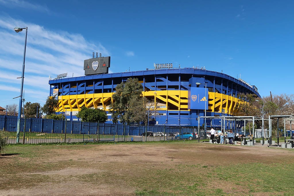 The iconic yellow and blue exterior of the La Bombonera football stadium in La Boca.