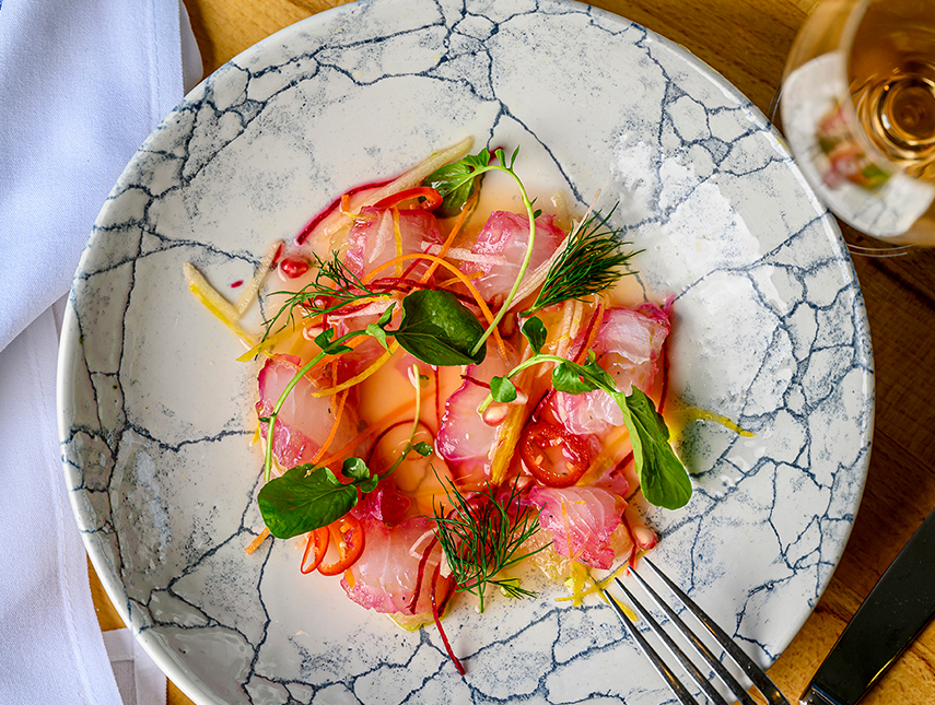 A gourmet plated seafood dish served at an upscale restaurant.