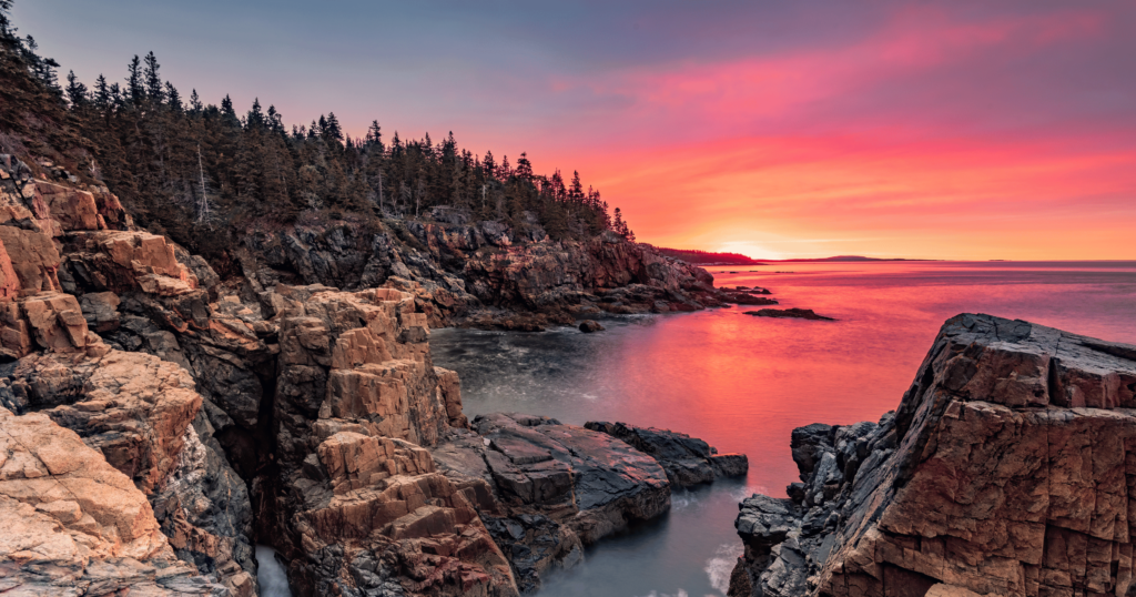 The rugged, rocky coastline of Acadia National Park overlooking the Atlantic Ocean.