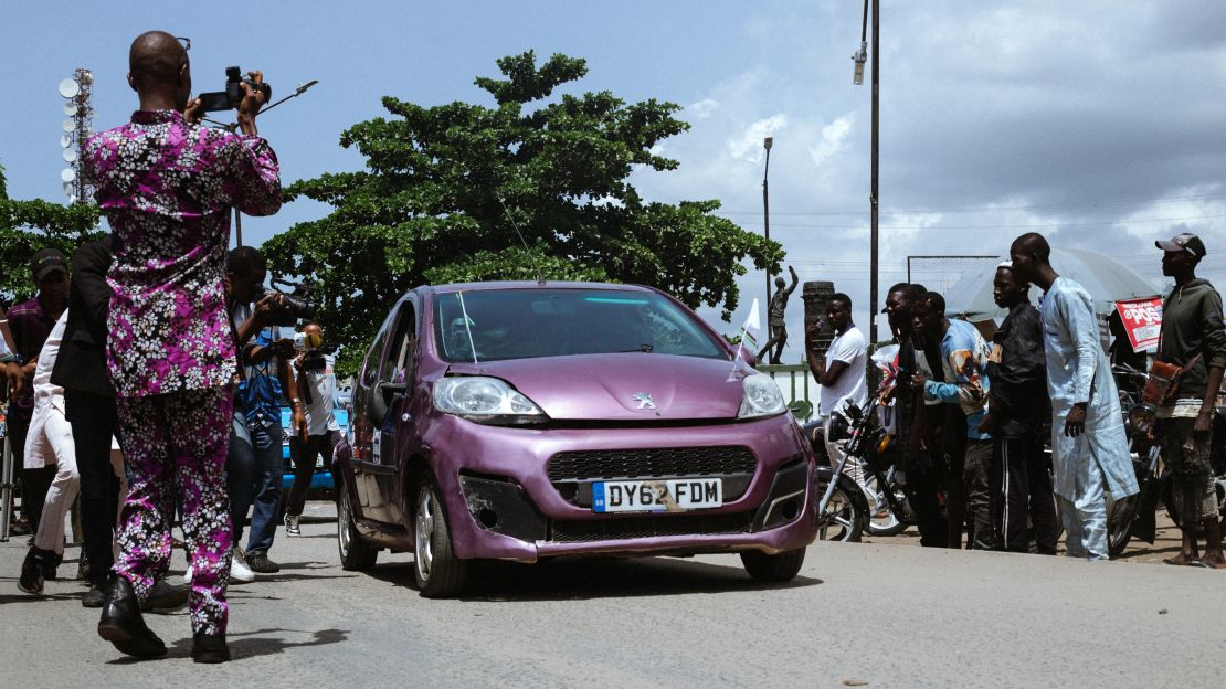 Pelumi Nubi celebrating with a large crowd and supporters upon her arrival in Lagos.