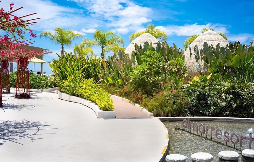 The modern white domed architecture and tropical landscaping of Almar Beach Resort.