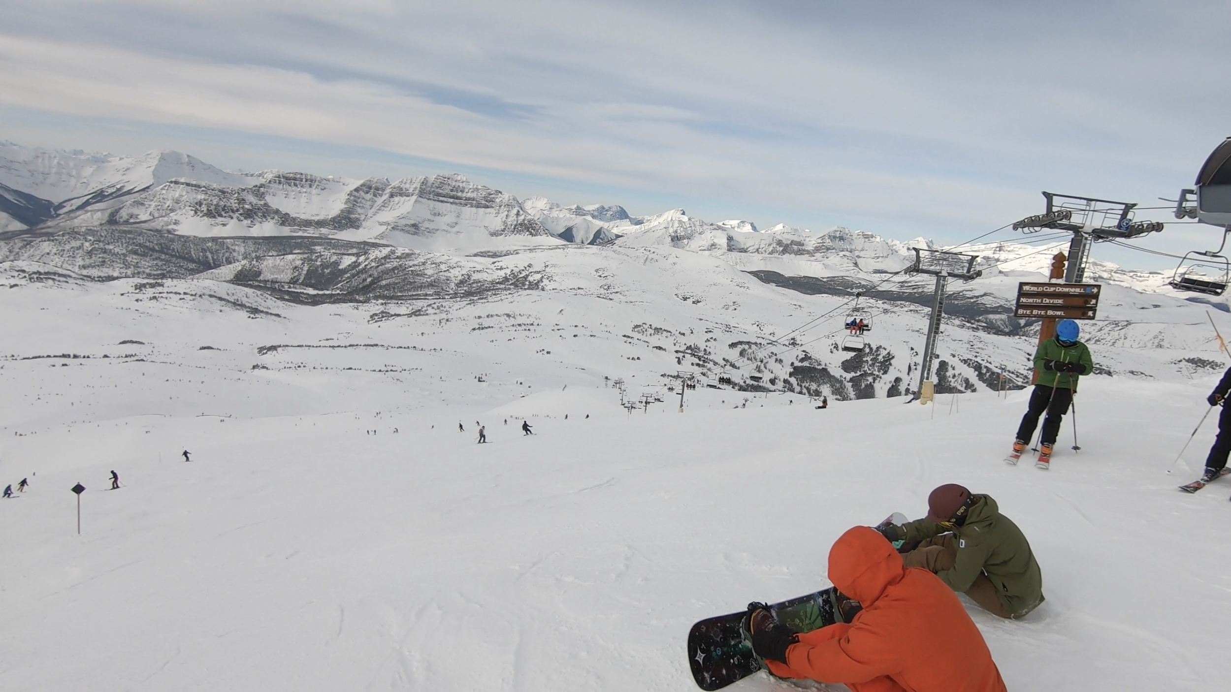 Wide, sunny ski slopes at Banff Sunshine Village with mountain ranges in the background.