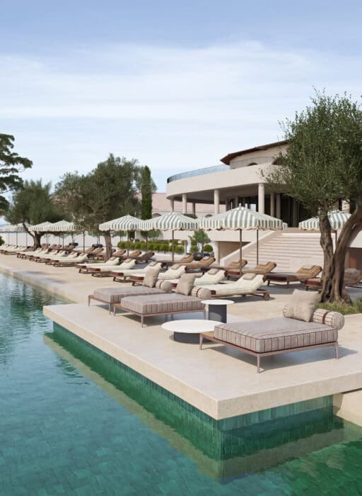 Luxury infinity pool overlooking the blue sea at Conrad Corfu.