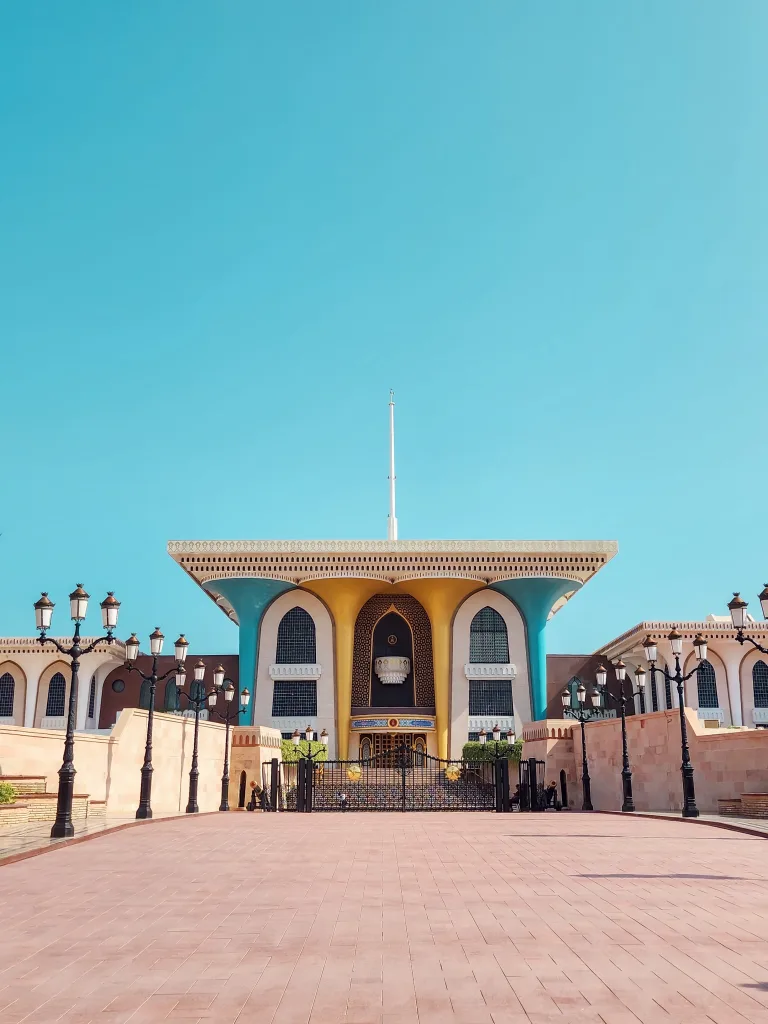 A woman exploring the intricate traditional architecture of Muscat.