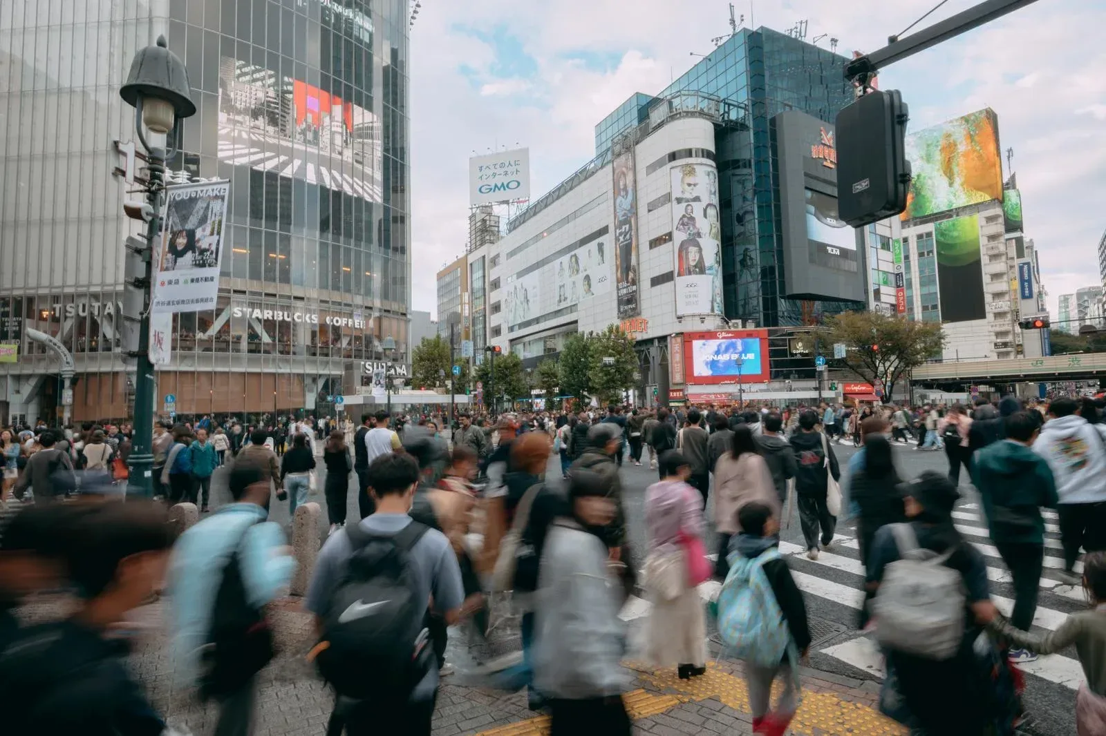 Dynamic street view of Shibuya's busy shopping district.